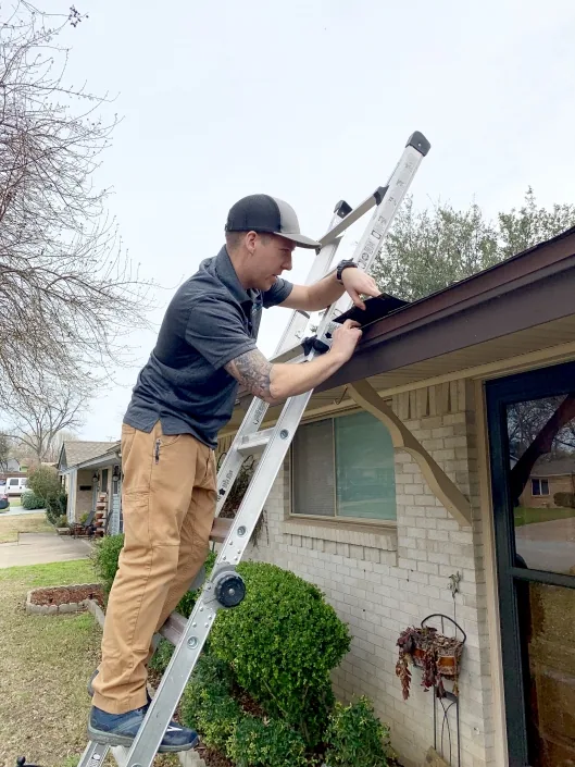 Peaked inspecting a roof
